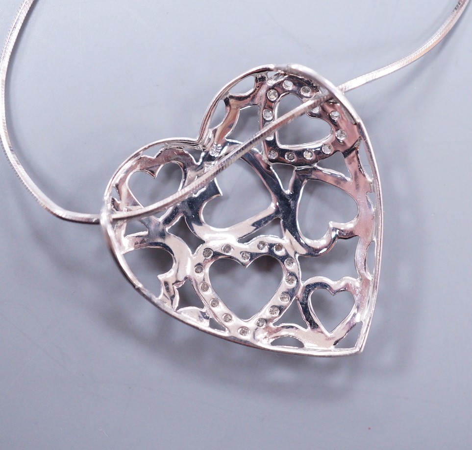 A modern 9k white metal and diamond chip set open work heart pendant, 26mm, on a 9ct white gold fine chain, 43cm, gross weight 5 grams